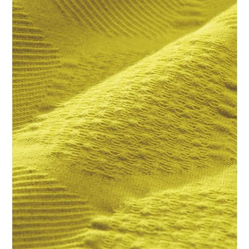 サフランイエロー 生地拡大<br>凹凸感のあるサークル柄のふくれジャカードがモダンな肌にやさしい綿100%素材。