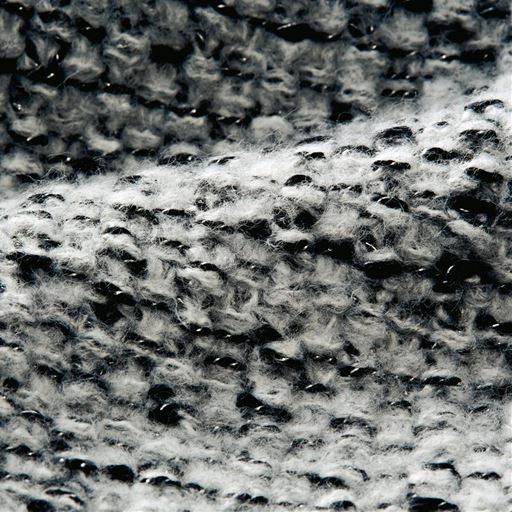 ブラック系 ラメ糸がほのかに煌めいて、サッと羽織るだけで優美なムードを醸し出すツイード見えカーディガン。