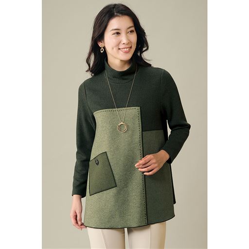 グリーン系<br>個性的なデザインでシックな印象の一枚。切替え部分が視線を集め体型カバーも。