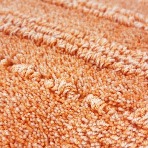 生地拡大(ピーチオレンジ)<br>風合いの異なる色の糸をミックスして見た目も楽しめるカラーに仕上げました。