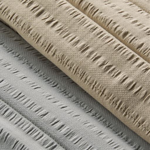 生地拡大 (上から) ベージュ・グレー<br>表面のポコポコとした凹凸がベタつきを防ぎます。