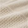 生地拡大(アイボリー)<br>凹凸のある、ざっくりした織地のワッフル生地を使用。